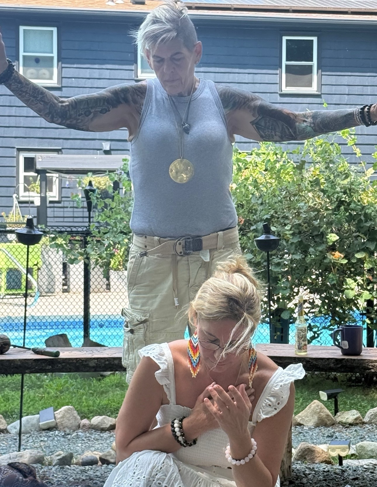 Karen with arms raised in ceremony